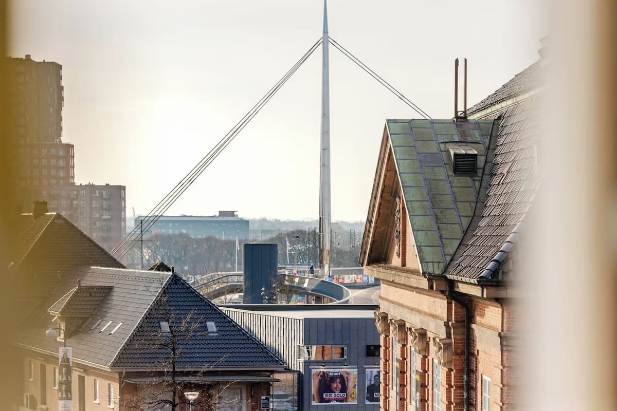 Bridge pylon and rooftops viewed from a room window